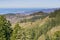 View towards the Pacific Ocean and Pillar Point Harbor from Purisima Creek Redwoods Park on a clear day, California