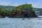 A view towards a rocky headland at the entrance to Castries harbour, St Lucia