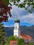 View of the tower of the Catholic parish church of St. Peter and Paul in Oberammergau, Bavaria, Germany