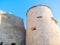 View of the tower and fragment of the city walls of Alghero. Sardinia, Italy