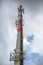 View of a tower with telecommunications antennas, concrete pole structure and equipments