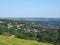 View of the town of halifax from high west yorkshire countryside surrounded by trees fields and nearby villages