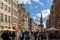 View of the Town Hall and tourists and local people strolling on the Long Lane at the Main Town Old Town in Gdansk