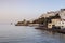 View of the town lighthouse, fortress, church and the sea Greece, island Andros, Cyclades