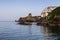 View of the town lighthouse Tourlitis, fortress and the sea Greece, island Andros, Cyclades