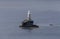 View of the town lighthouse Tourlitis and the sea Greece, island Andros, Cyclades