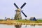 View of traditional 18th century windmills and water canal in Kinderdijk, Holland, Netherlands