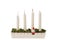 View of traditional advent candlestick with one lighted candle  symbolizing third advent isolated  on white background