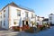 View of the traditional buildings and street cafe in the historic center of Faro, Algarve, Portugal