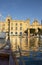 View from traditional maltese water taxi boat, dghajsa, arriving in Birgu water taxi station, by grand harbour marina, Maritime