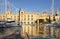 View from traditional maltese water taxi boat, dghajsa, arriving in Vittoriosa landing place, by grand harbour marina, Maritime