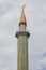 View of traditional mosque minaret tower, distinctive architectural feature of mosques. Traditional and typical mosque