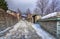 View of traditional stone buildings and streets with snow at the famous village of Nymfaio near Florina.