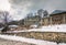 View of traditional stone buildings and streets with snow at the famous village of Nymfaio near Florina, Greece