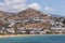 View of the traditional, white buildings in port, Ios, Greece