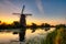 View of traditional windmills at sunset in Kinderdijk, The Netherlands