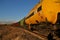 View of the train of cisterns and wagons at sunrise against the blue sky.