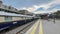 View of a train station with Venice Simplon Orient Express train on the train tracks