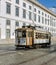 View of tram in Porto, with historical Portuguese building behind