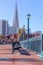 View of Transamerica Pyramid from historic wooden Pier 7 famous San Francisco promenade