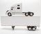 View of transport truck and trailer model on white, grey background