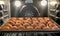 View of Tray of Raw Meatballs inside Oven ready to be baked.