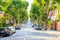 View of a treelined uphill street with a school children sign in West Hampstead of London