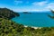 A view through the trees of a beach at the incredibly beautiful Able Tasman National Park, South Island, New Zealand