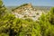 A view through the trees of the hilltop church above the town of Montefrio, Spain