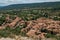 View of trees, house roofs and belfry in Moustiers-Sainte-Marie