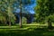 A view through trees towards the fourteen arches viaduct at Wolverton, UK