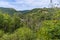 A view through the trees towards the viaduct on the Monsal Trail in Derbyshire, UK