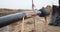 View of the trenches at a construction site, laying pipeline outdoors, 4k