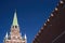 View of the Trinity tower of the Moscow Kremlin with a fortress wall on a Sunny spring day. World tourism, sights of