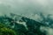 View of Trongsa Dzong with foggy hills, Bumthang, Bhutan, Asia.