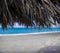 View of Tropical Beach with Blue Ocean, Sea and White Sand. Palm Tree Umbrella, Heavenly Vacation Spot, Tropical Banner.