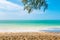 View from tropical beach at Koh Lanta island, Thailand. View to pure sea with boats and yacht on water. Look from shadow of tree