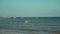 View of tropical beach on sunset. Parasailing boats on pier. Turquoise water of the Caribbean Sea. Riviera Maya Mexico