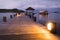 View of tropical island pier and yacht in twilight