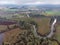 View at Tualatin river from above. Scenic view of a farming fields and trees on sides of a river