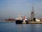 View of a tugboat moored in the harbor next to fishing boats