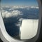 View of the turbine airplane, clouds and the Earth