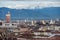 View of Turin with Torre Littoria and snowcapped Alps