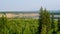 View of the turn of the Northern Yakut river vilyu reflected among the steep banks of the hills and spruce forest on the mountain