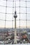 View of TV tower Fernsehturm through mesh fencing