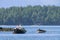 View of two small wooden sailboats on a lake