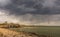 The view of Tynemouth, Cullercoats & Whitley Bay including St Mary`s Lighthouse taken from Tynemouth`s North Pier on a rainy day