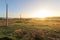 View of typical Alentejo landscape with Portuguese village in morning fog an rising sun at the Rota Vicentina hiking trail near