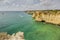 View on typical cliffy beach at Algarve coastline in Portugal in summer