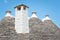 View of the typical conic roof of trullo buildings. Alberobello,  Puglia. Italy